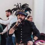 Schuggie with his trademark steampunkest felt hat, microphone in hand calling a dance. Slàinte Mhath, Schuggie, from Schuggies-Ceilidhs.